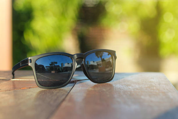 istock Black glasses on a wooden table 696414358