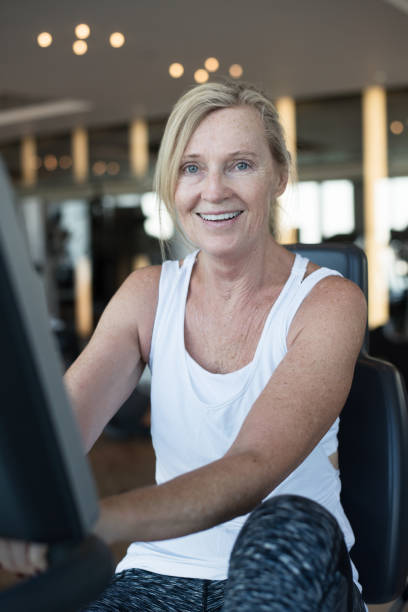 Mature happy woman working out stock photo