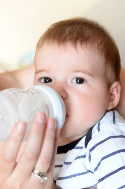 istock Baby drinking water from the bottle 696417506