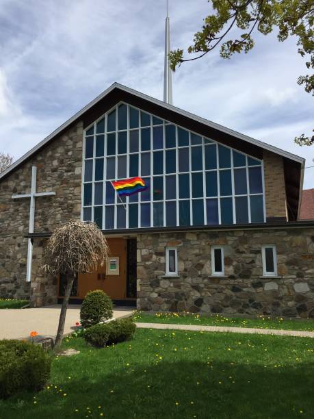 istock LGBT flag on church's flagpost 696417576