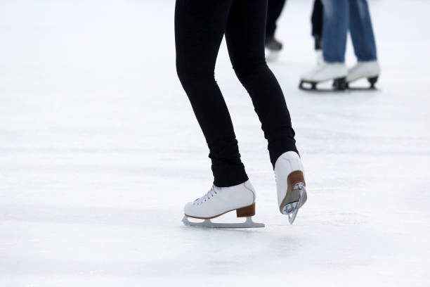 istock feet skating on the ice rink 696425622