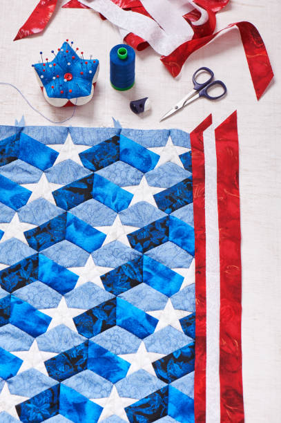 istock Sewing of quilt with stylized elements of American flag 696430682