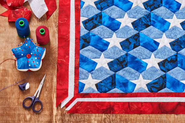 istock Sewing of quilt with stylized elements of American flag 696430686