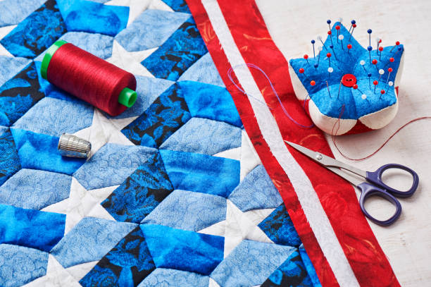 sewing of quilt with stylized elements of american flag - patch textile stack heap imagens e fotografias de stock