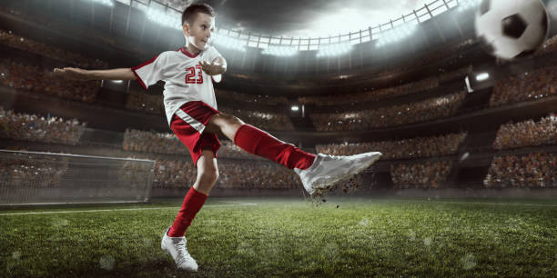 istock Soccer kids player in action in 3D dramatic stadium 696437202