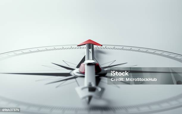 Compass On White Background With Selective Focus Stock Photo - Download Image Now - Navigational Compass, Direction, Concepts