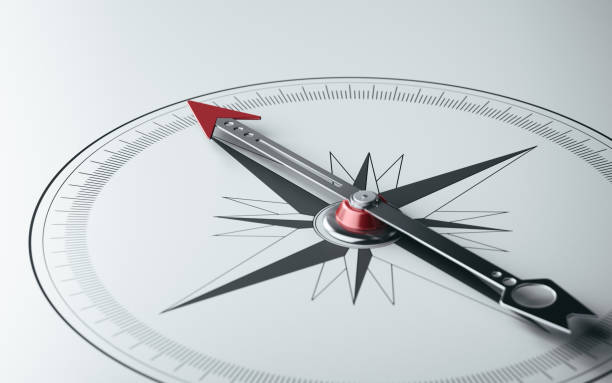 Compass on White Background with Selective Focus Compass on white background with selective focus. Compass is lit from the upper left corner of composition. Horizontal composition with copy space. southern turkey stock pictures, royalty-free photos & images