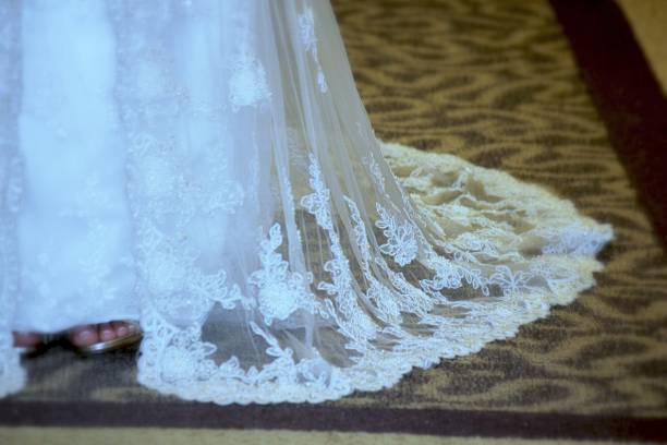 istock Hem of a white wedding dress 696440976