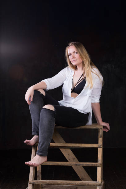 istock Blond woman on a dark background 696453656