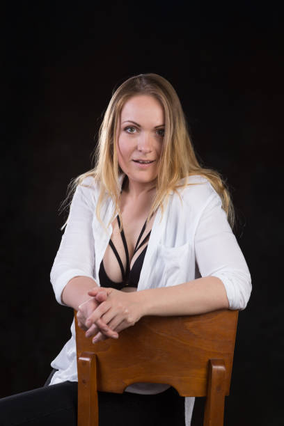 istock Blond woman on a dark background 696453746
