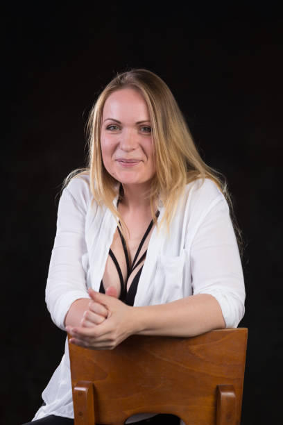 istock Blond woman on a dark background 696453840