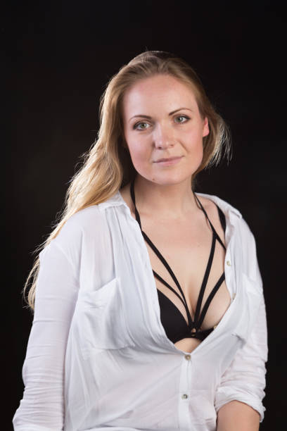 istock Blond woman on a dark background 696454678