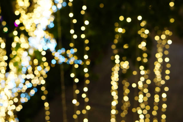 istock Beautiful colorful blurred lights background during greeting season. 696467764