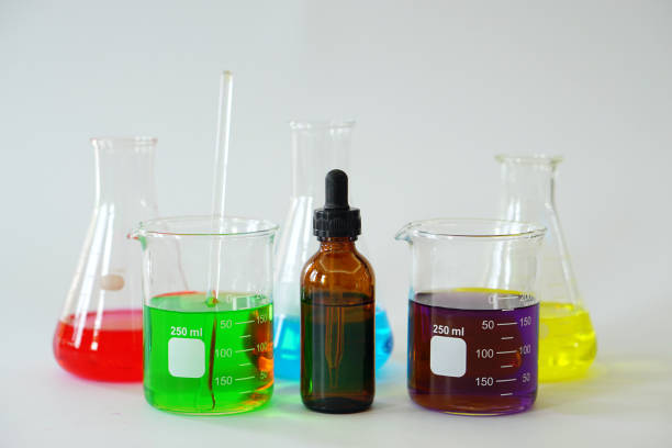 Group of Laboratory Glass Erlenmeyer conical flask and Beaker filled with chemical liquid for a chemistry experiment in research lab.