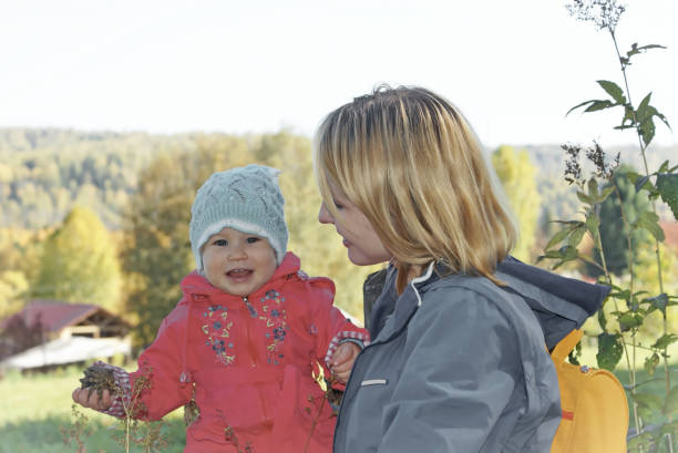istock Mother and Child in Nature in summer 696470134