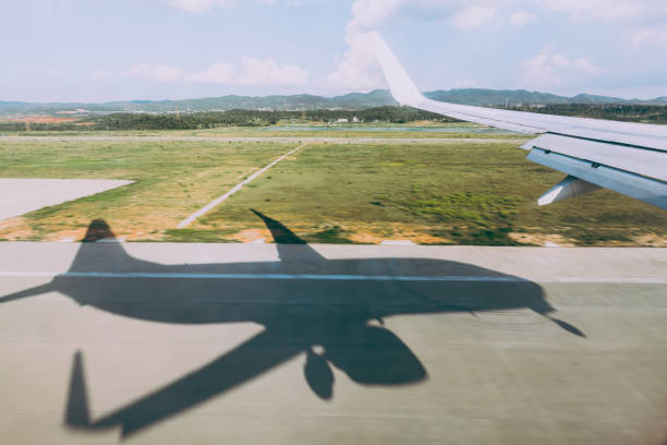 istock Aerial view of airplane flying 696470344