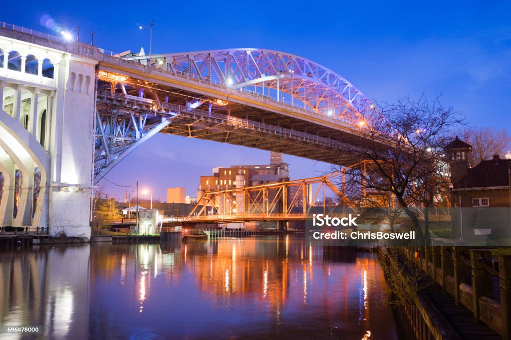 Detroit–Superior Bridge Cuyahoga River in Cleveland, Ohio Night falls on the river and a bridge that carries traffic into the city Cleveland - Ohio Stock Photo