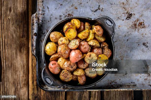 Pan Fried Yukon Gold Potatoes With Herb In Cast Iron Stock Photo - Download Image Now