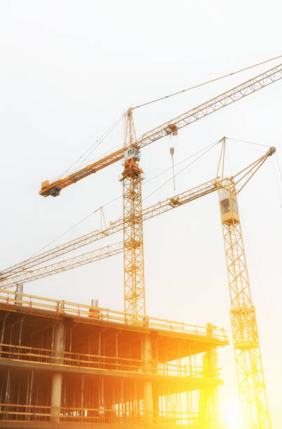 istock Industrial construction cranes in the city. 696493268