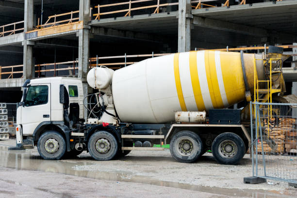 istock Concrete mixer truck on construction site. 696493276
