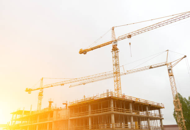 istock Industrial construction cranes in the city. 696493280