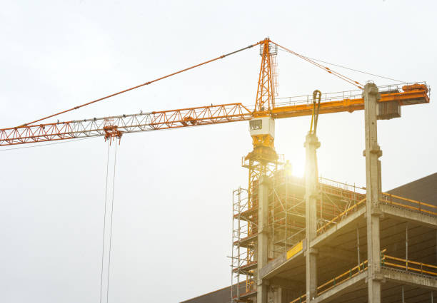 istock Industrial construction crane in the city. 696493332