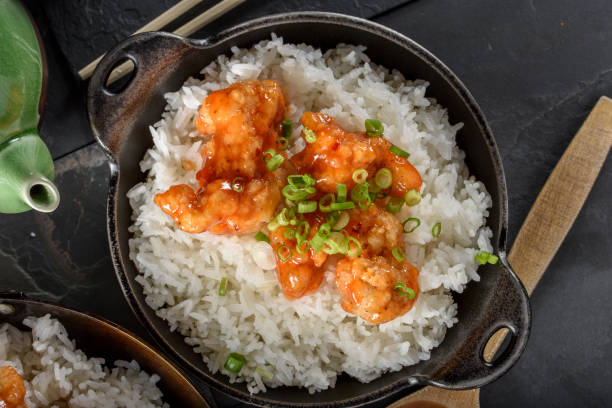 istock Orange Chicken over Steamed Rice 696493636