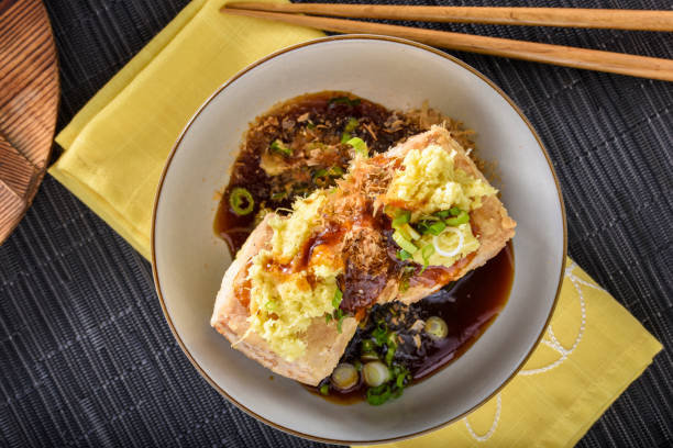 istock Agedashi, Deep Fried, Tofu with Ground Ginger , Scallion and Soy Sauce 696496138