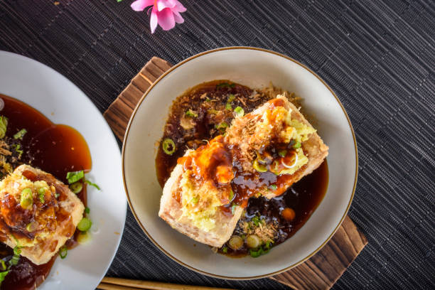 istock Agedashi, Deep Fried, Tofu with Ground Ginger , Scallion and Soy Sauce 696496318