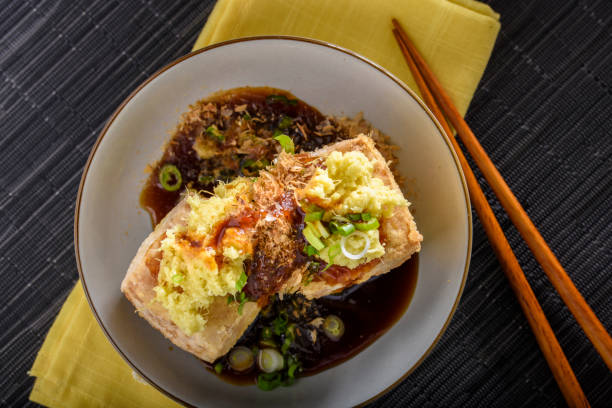 istock Agedashi, Deep Fried, Tofu with Ground Ginger , Scallion and Soy Sauce 696496412