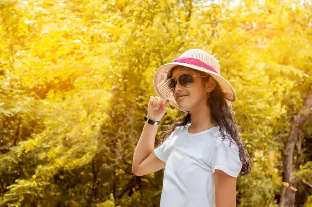 Beautiful teenager girl wearing a white hat,Have fun and relaxing in the beautiful nature.Concept lifestyle