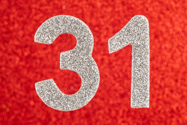 istock Number thirty-one silver color over a red background. Anniversary. Horizontal 696504456
