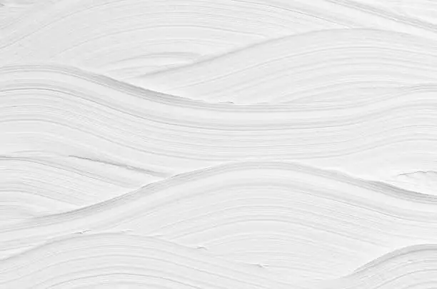 Photo of White wave plaster texture. Light modern abstract background.
