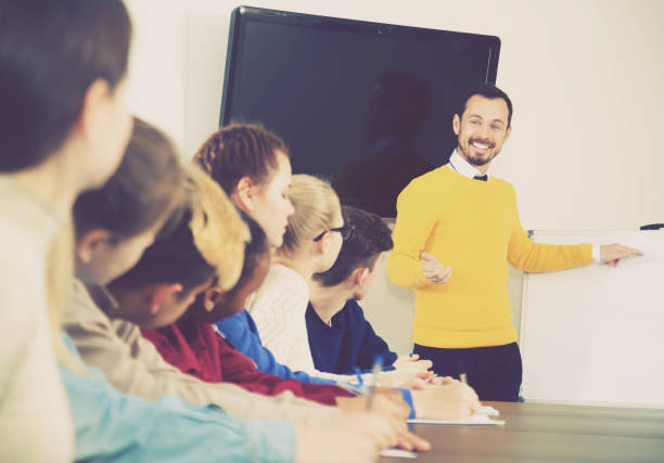 istock Students listening to teacher 696511536