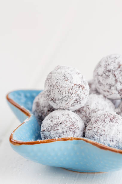 istock Chocolate truffle with sugar powder on white 696518490