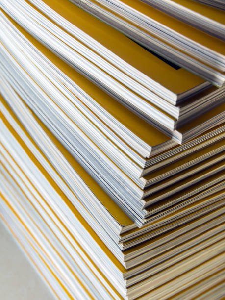 istock Stack of yellow monthly magazine 696519188