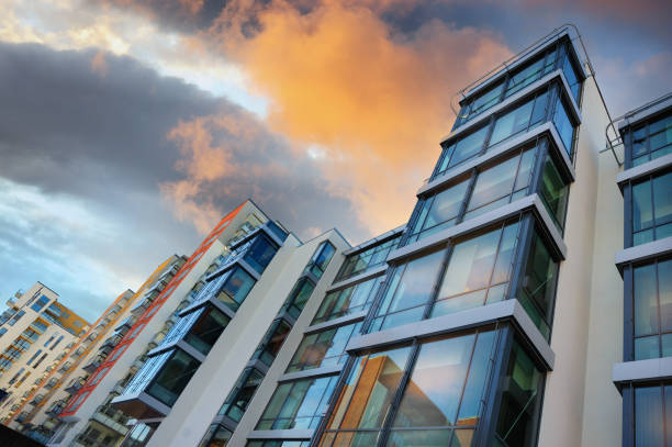 istock Apartment buildings in row, early evening 696521852