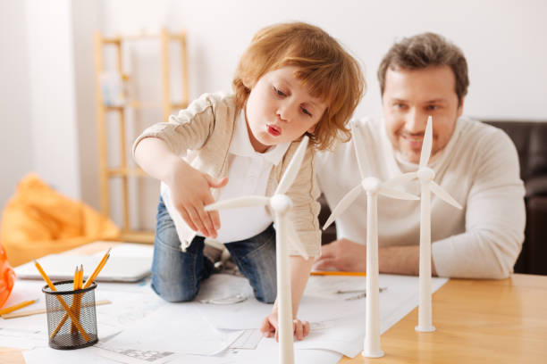 Positive delighted man looking at his son