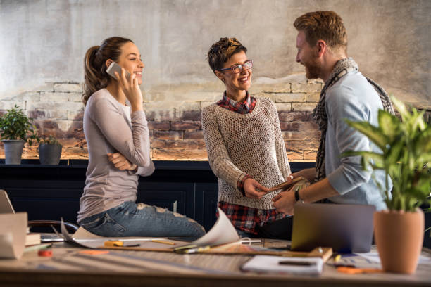 istock Happy freelance workers working in the office. 696522336