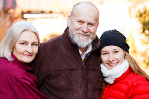 istock Happy elderly couple with the young carer 696524452