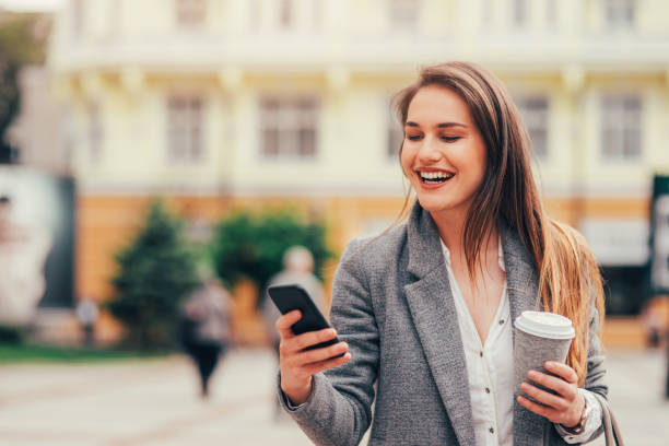 istock Woman texting in the city 696526266