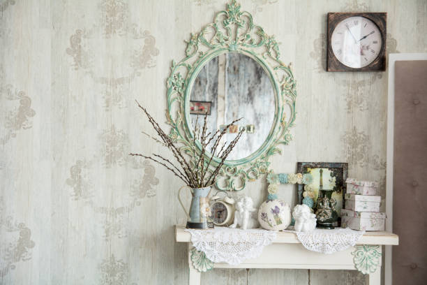 istock Vintage interior with mirror and a table vase and willows 696526746