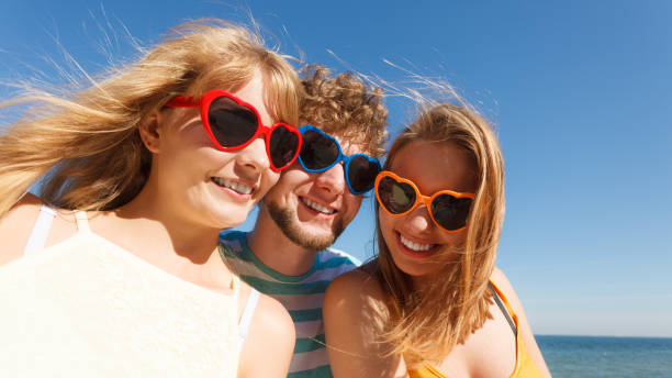 istock Group friends boy two girls having fun outdoor 696529264