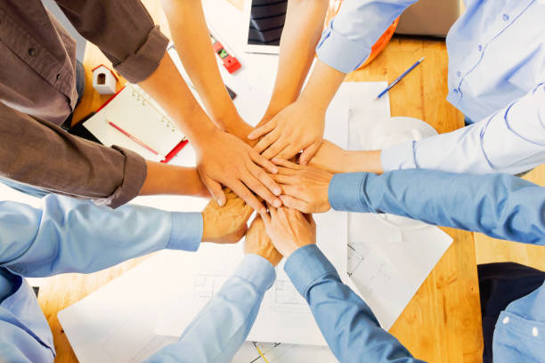 istock Team of engineers working together in a architect office. 696532506