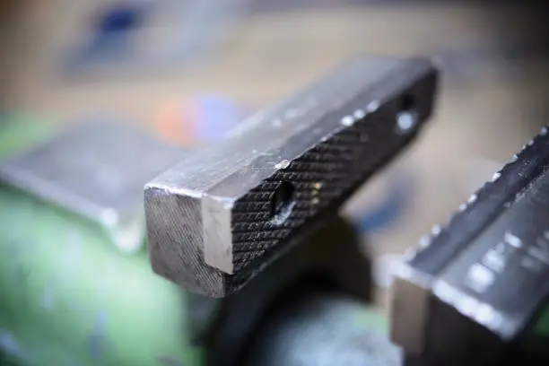 A used vise inside a workshop