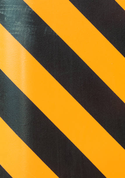 istock black and yellow strip line background 696535642
