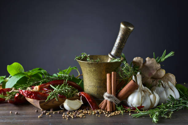 istock Different herbs and spices on a wooden table . 696536186