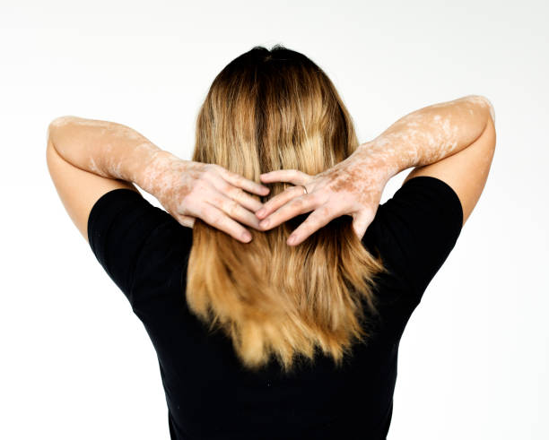 istock Woman standing in rear view studio portrait 696537326