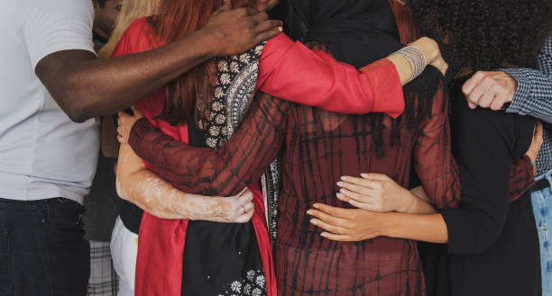 istock Group of people huddle together 696537430