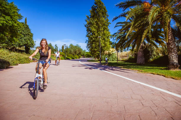 istock Single Father With Daughters Discovery Valencia With Bicycle 696540110